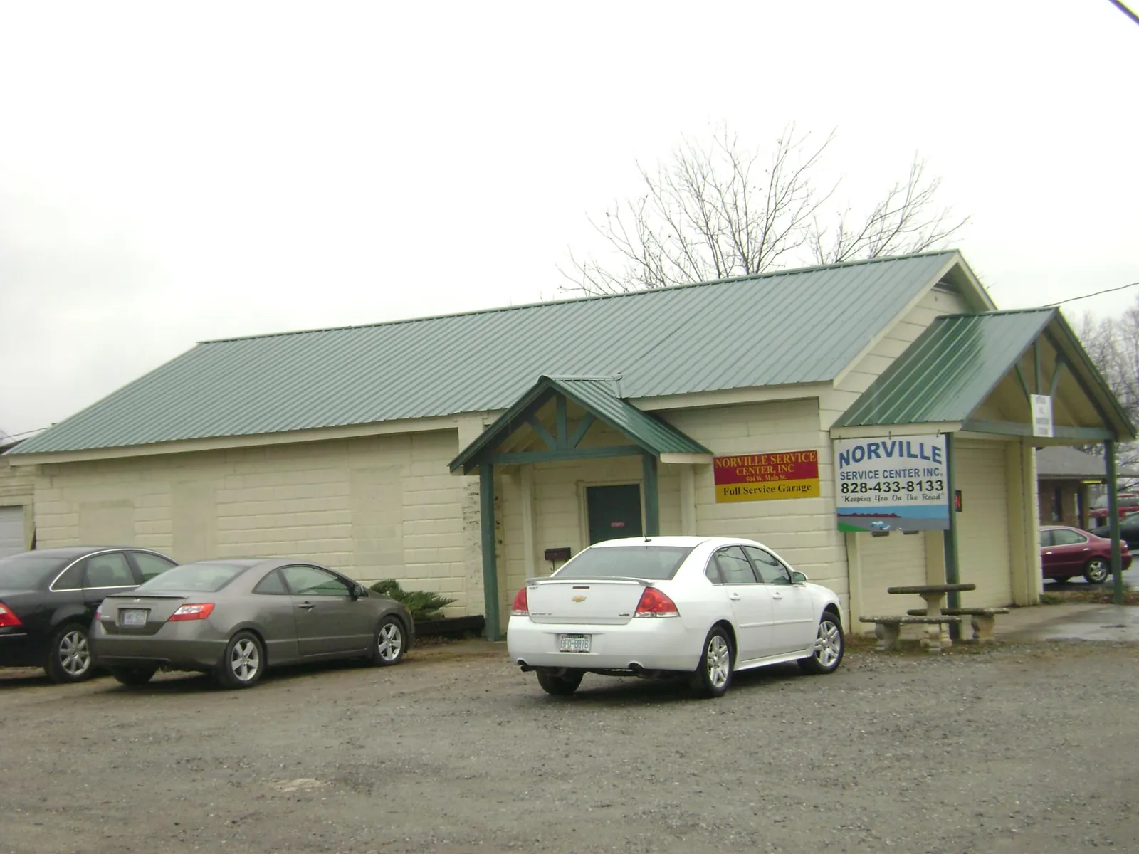 Green metal roof on a service garage with a covered entry in Port Saint Joe